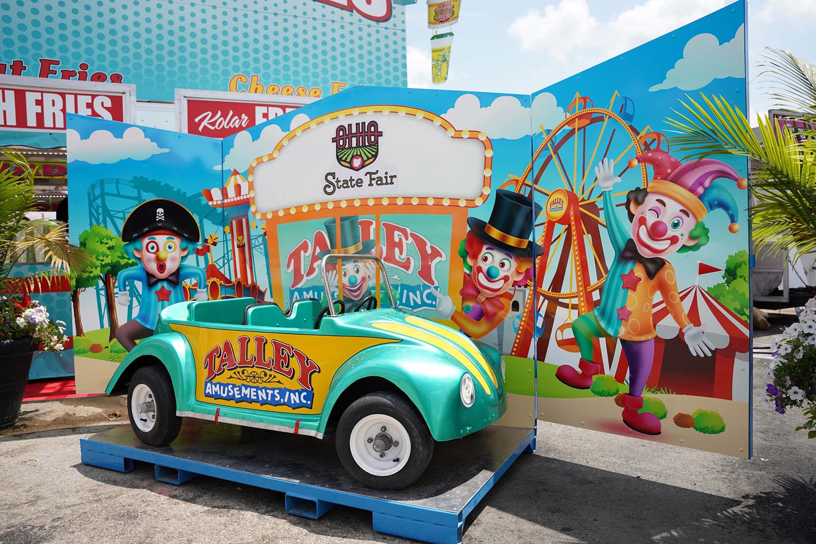 Take a photo at Talley's kid-sized car displays