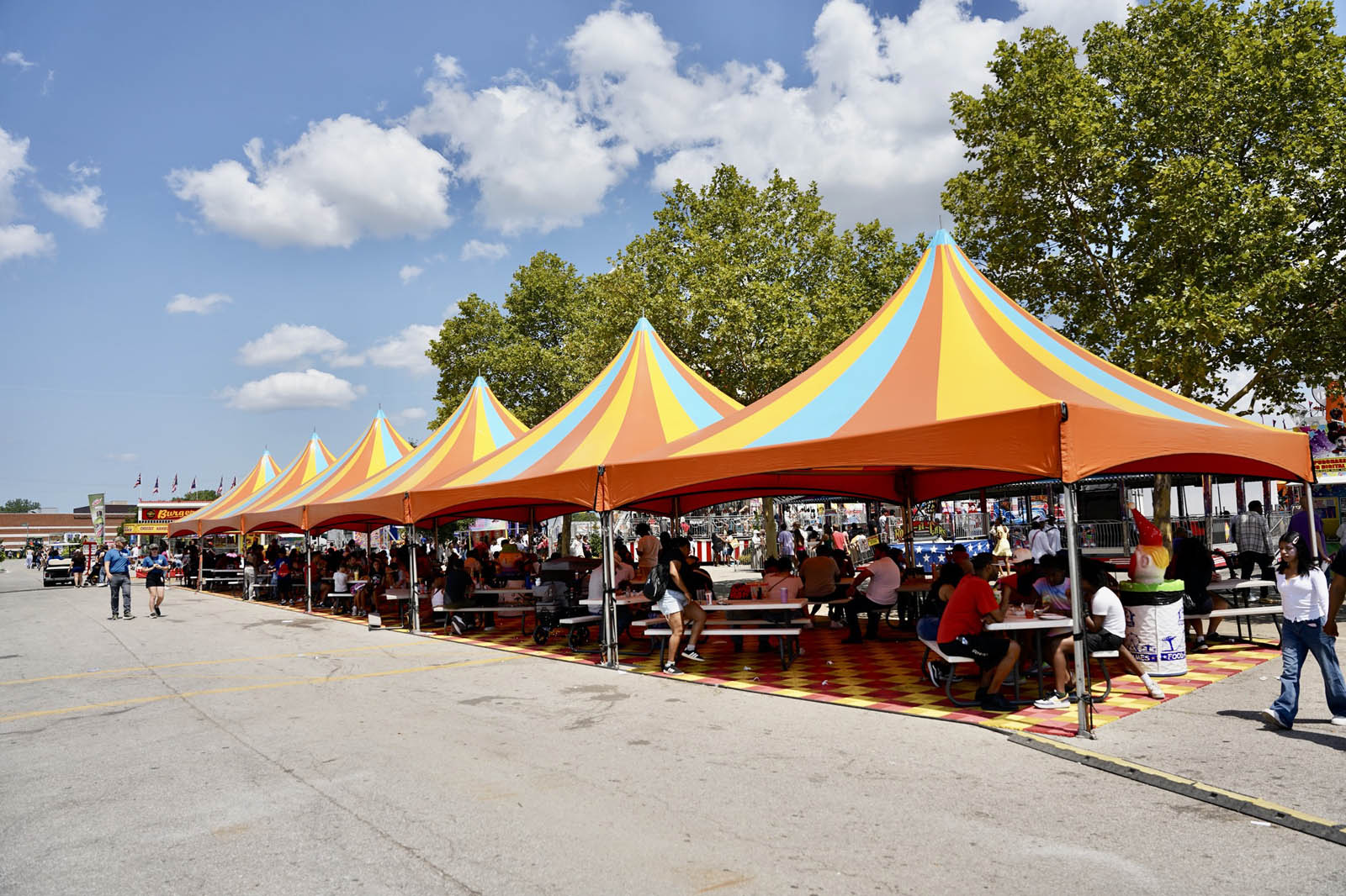 Food tables and covering tents on the Talley Amusements midway