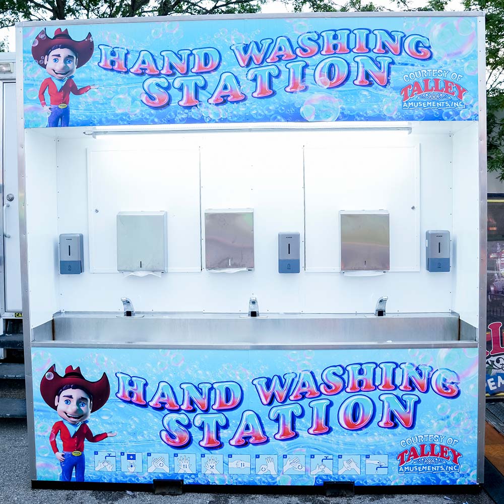 Handwashing station with three separate sinks for guests