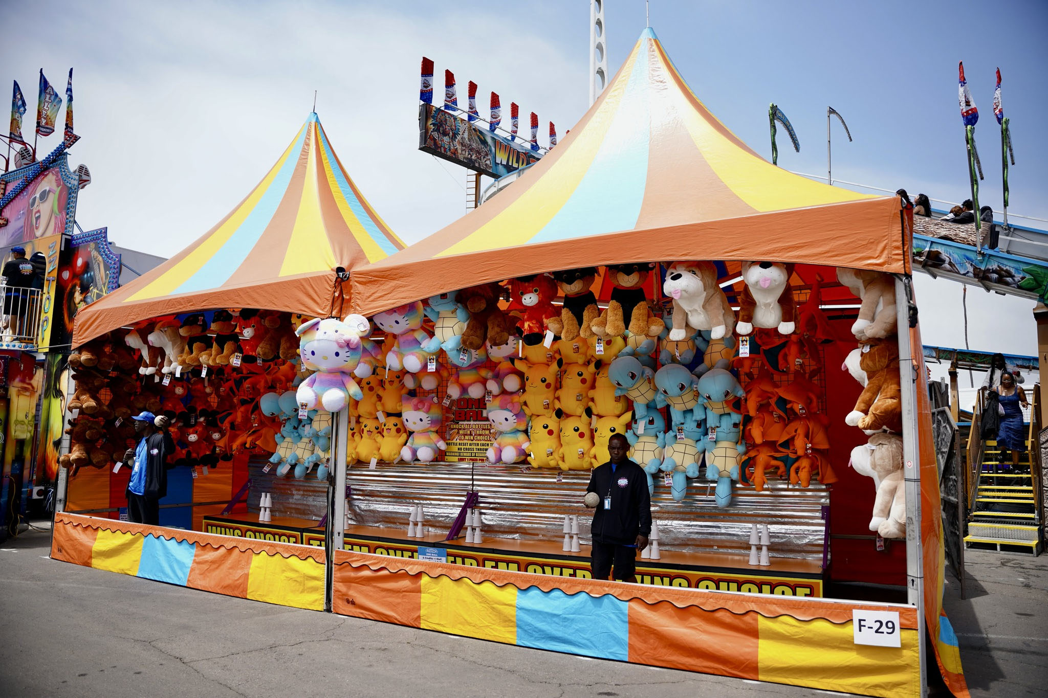 One Ball carnival game with stacked bottles