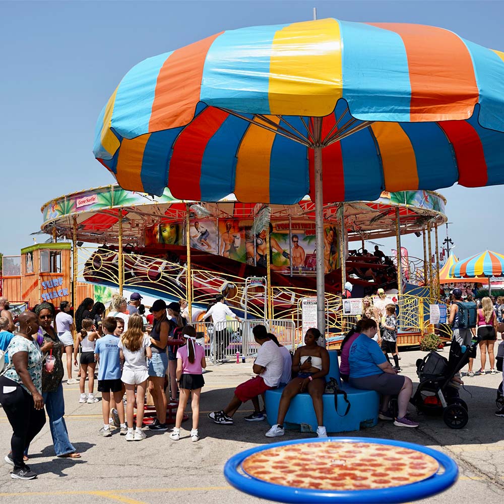 Midway guests beat the heat with Talley Amusements sunbrellas